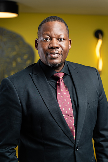 Mr. Nicholas. Mukasa - Member of the Management Commitee of the Bank